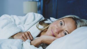 woman lying on bed